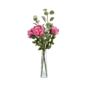 Glass vase of artificial peonies and eucalyptus