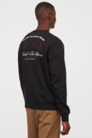  Sweatshirt with a motif £10.00