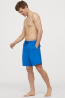 HM  Knee-length swim shorts