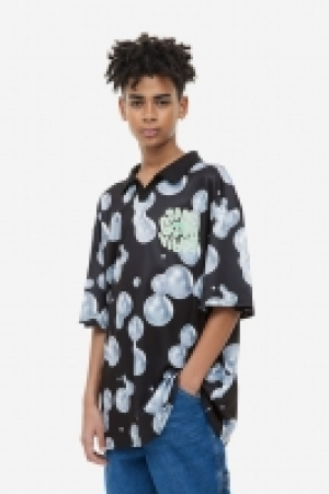 HM  Oversized printed polo shirt