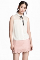 HM   Sleeveless lace-yoke blouse